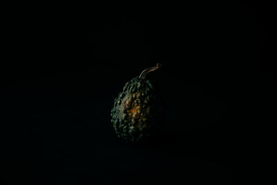 Close-up of pineapple against black background