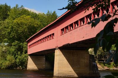 View of text on bridge against plants