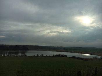 Scenic view of agricultural landscape against sky