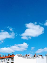 Low angle view of building against blue sky