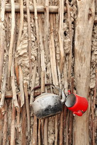 0297 old teapots-reed and mud wall-seasonal hut of uyghur people-taklamakan desert. xinjiang-china.