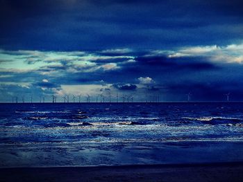 Scenic view of sea against dramatic sky