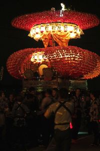 Low angle view of illuminated lanterns at amusement park