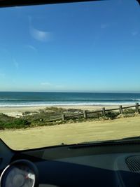 Scenic view of beach against clear sky