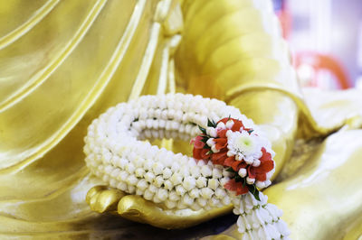 Close-up of yellow flowers on table