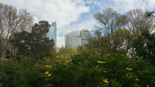 Buildings against cloudy sky