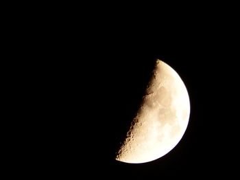 Low angle view of moon against clear sky at night