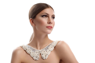 Portrait of a beautiful young woman over white background