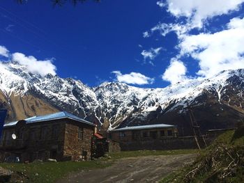 Scenic view of snow covered mountains against sky