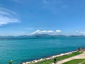 Scenic view of sea against blue sky