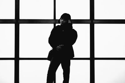 Portrait of silhouette woman standing against window japanese girl 
