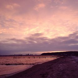 Scenic view of sea against cloudy sky