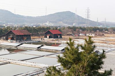 High angle view of houses and buildings against sky