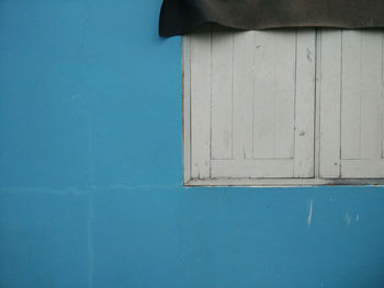 Low angle view of blue door on building