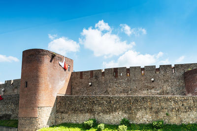 Low angle view of historical building in city against sky