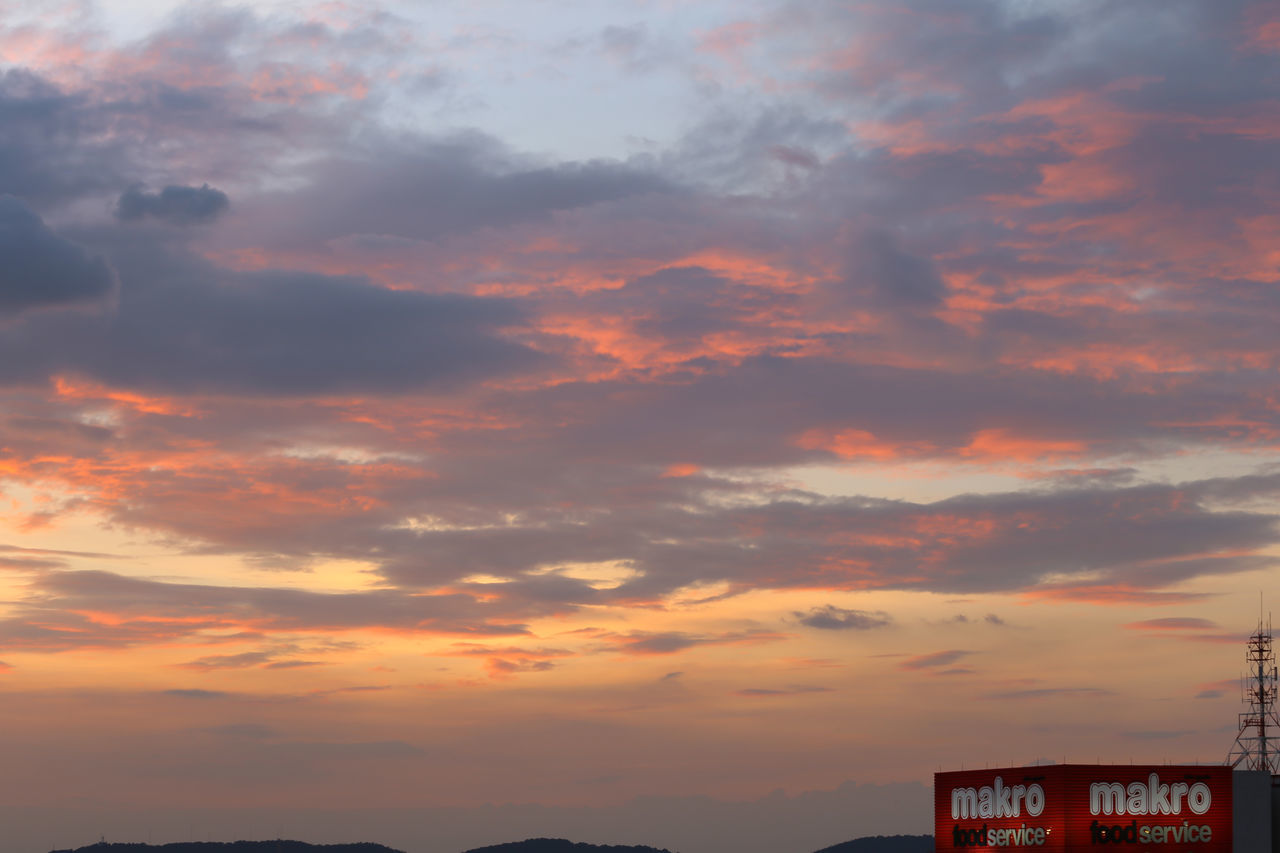 sky, cloud, sunset, architecture, nature, afterglow, beauty in nature, built structure, no people, evening, dramatic sky, orange color, scenics - nature, building exterior, dusk, horizon, outdoors, red sky at morning, tranquility, building, mountain, city, tranquil scene, travel destinations, red, environment