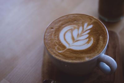 Close-up of cappuccino on table