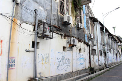 Low angle view of graffiti on old building