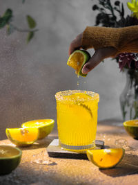 Close-up of orange juice on table