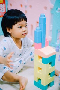 Close-up of boy playing with toy blocks