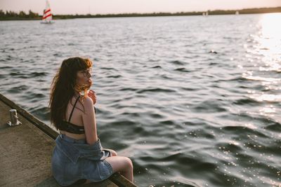 Woman sitting in sea