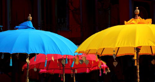 Colorful umbrellas against temple