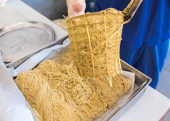 High angle view of person preparing food on table