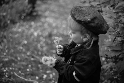 Portrait of child with dandelions