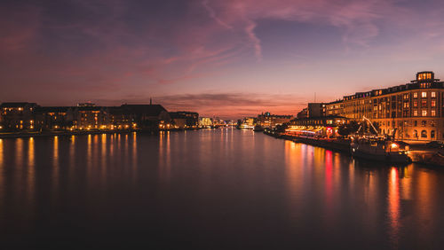 View of illuminated city at sunset