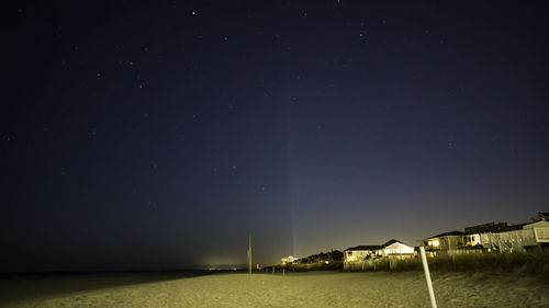 Scenic view of sea against sky at night