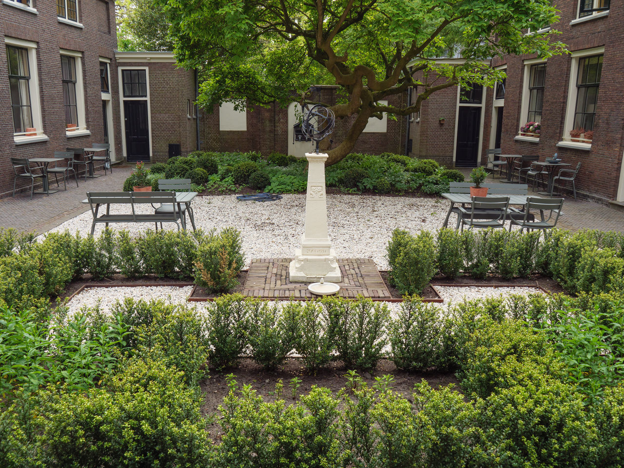 PLANTS IN GARDEN AGAINST BUILDING