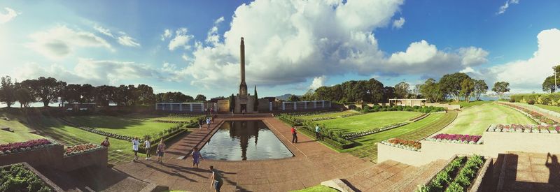 Trees against cloudy sky