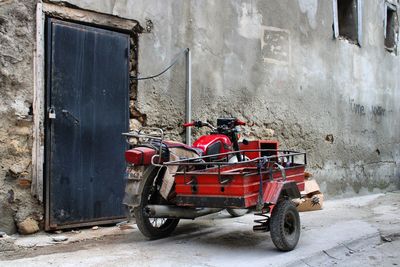 Motorcycle on street against building