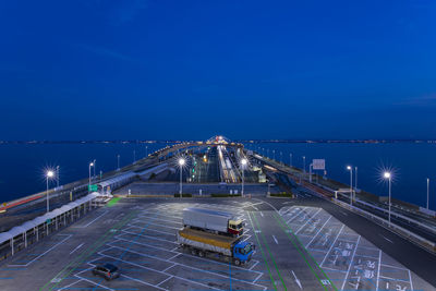 Pier over sea against blue sky