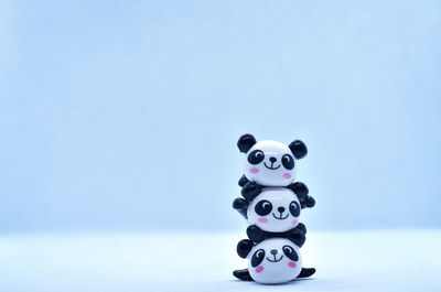 Close-up of toys on table against blue background