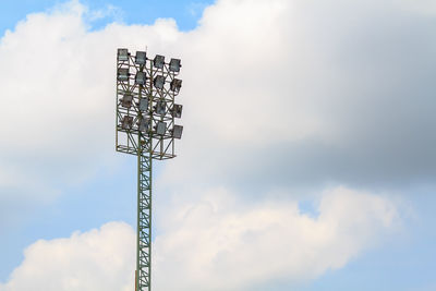 Low angle view of floodlight against sky