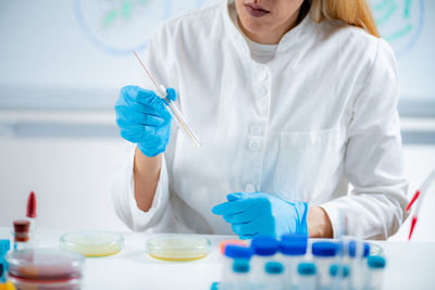 Microbiology lab technician working with petri dishes