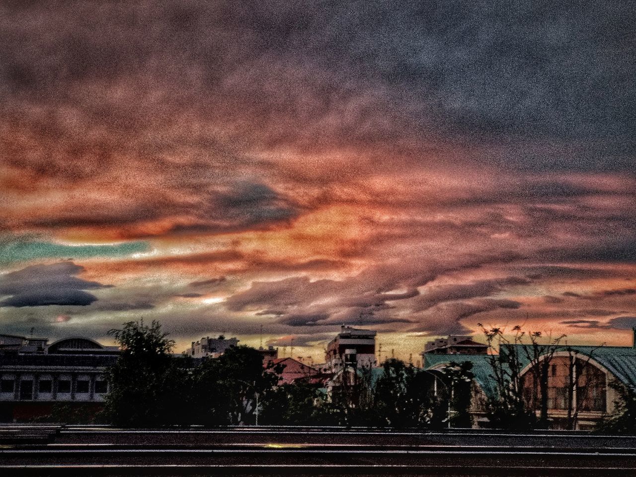 STORM CLOUDS OVER CITY BUILDINGS