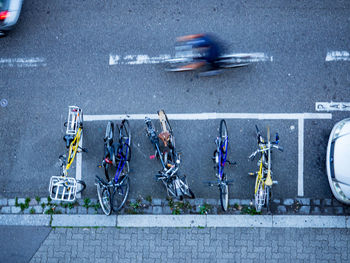 High angle view of bikes and a person cycling on road