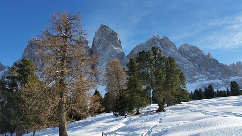 Scenic view of snow covered mountains against sky