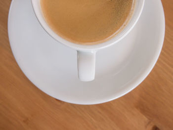 High angle view of coffee in cup on table
