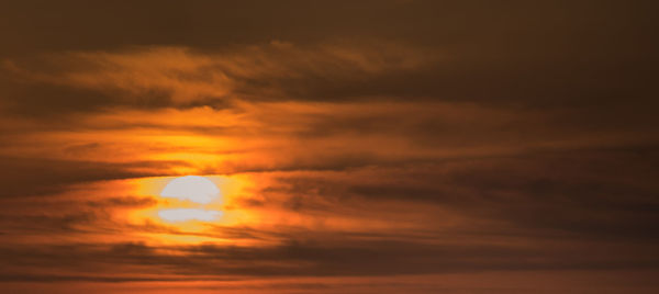 Low angle view of cloudy sky during sunset