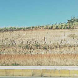 View of landscape against clear blue sky