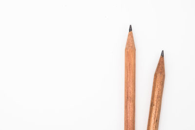 Close-up of colored pencils against white background