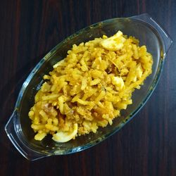 High angle view of yellow salad in bowl on table