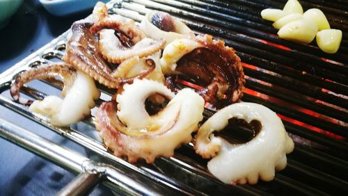 Close-up of meat on barbecue