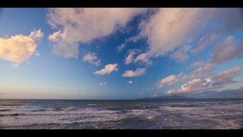 Scenic view of sea against cloudy sky