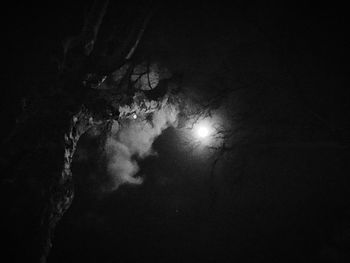 Low angle view of moon in sky at night