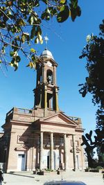Low angle view of church against blue sky