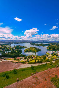 Scenic view of landscape against blue sky